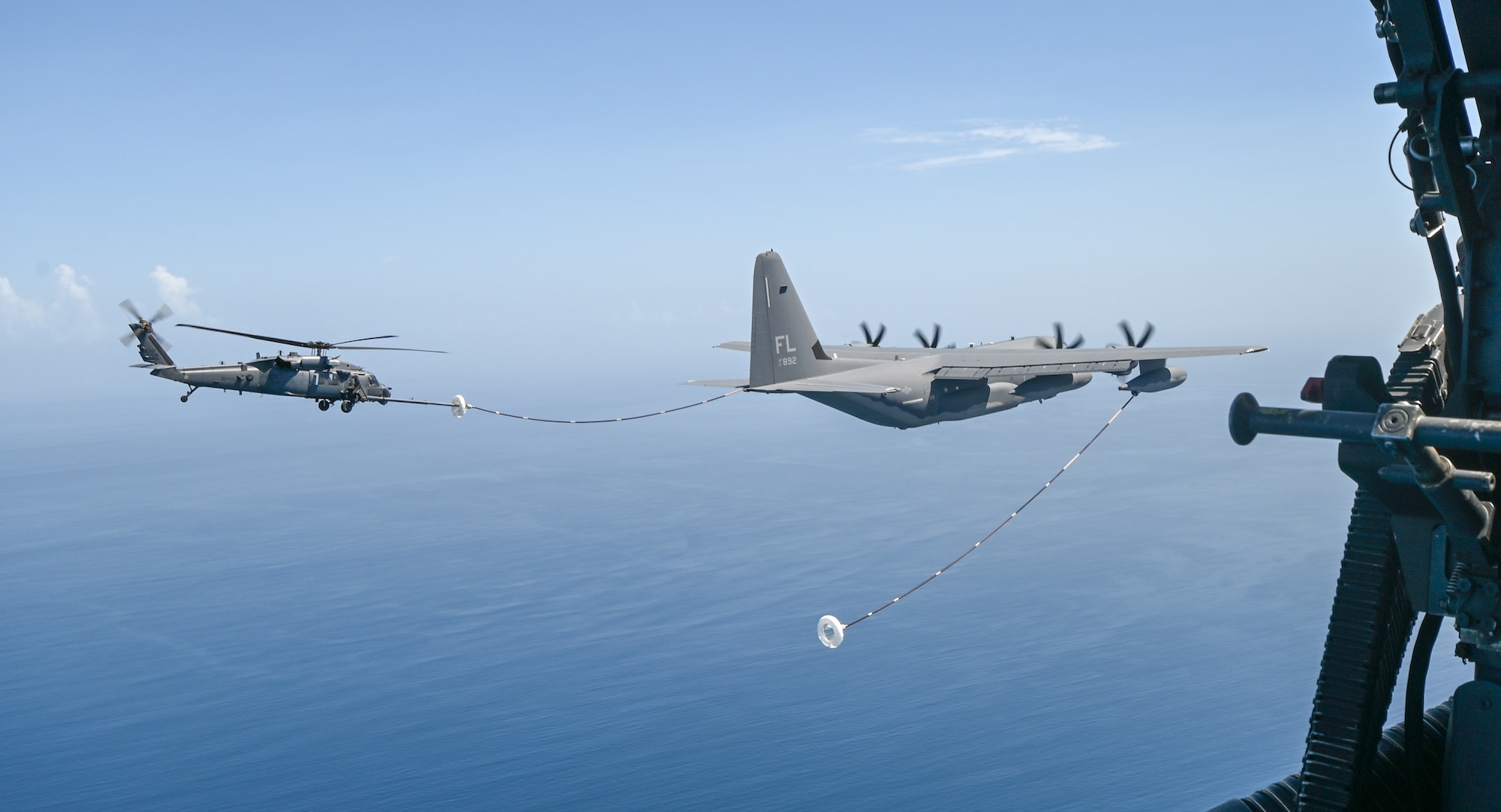 HC-130J Refuels HH-60G Pave Hawk Helicopters