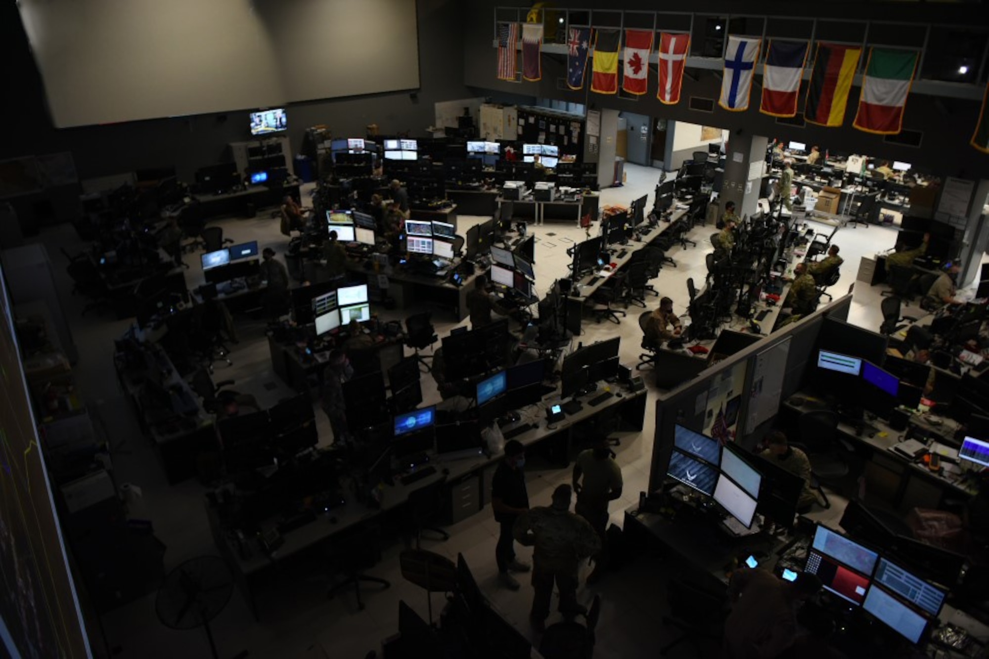 U.S. Air Forces Central Airmen work in the Combined Air Operations Center, Al Udeid Air Base, Qatar. AFCENT’s 609th Air Operations Center made history this week when it became the first AOC to operationally utilize the Kessel Run All Domain Operations Suite to plan and execute the Master Air Attack Plan. (U.S. Air Force photo by Staff Sgt. Dustin Mullen)