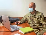 Sergeant Ryan Pang, Task Force Oahu, Hawaii National Guard, helps manually verify and update visitors' test results registered in the Safe Travels Hawaii program, Nov. 16, 2020, 298th Multi-Functional Training Regiment in Waimanalo.