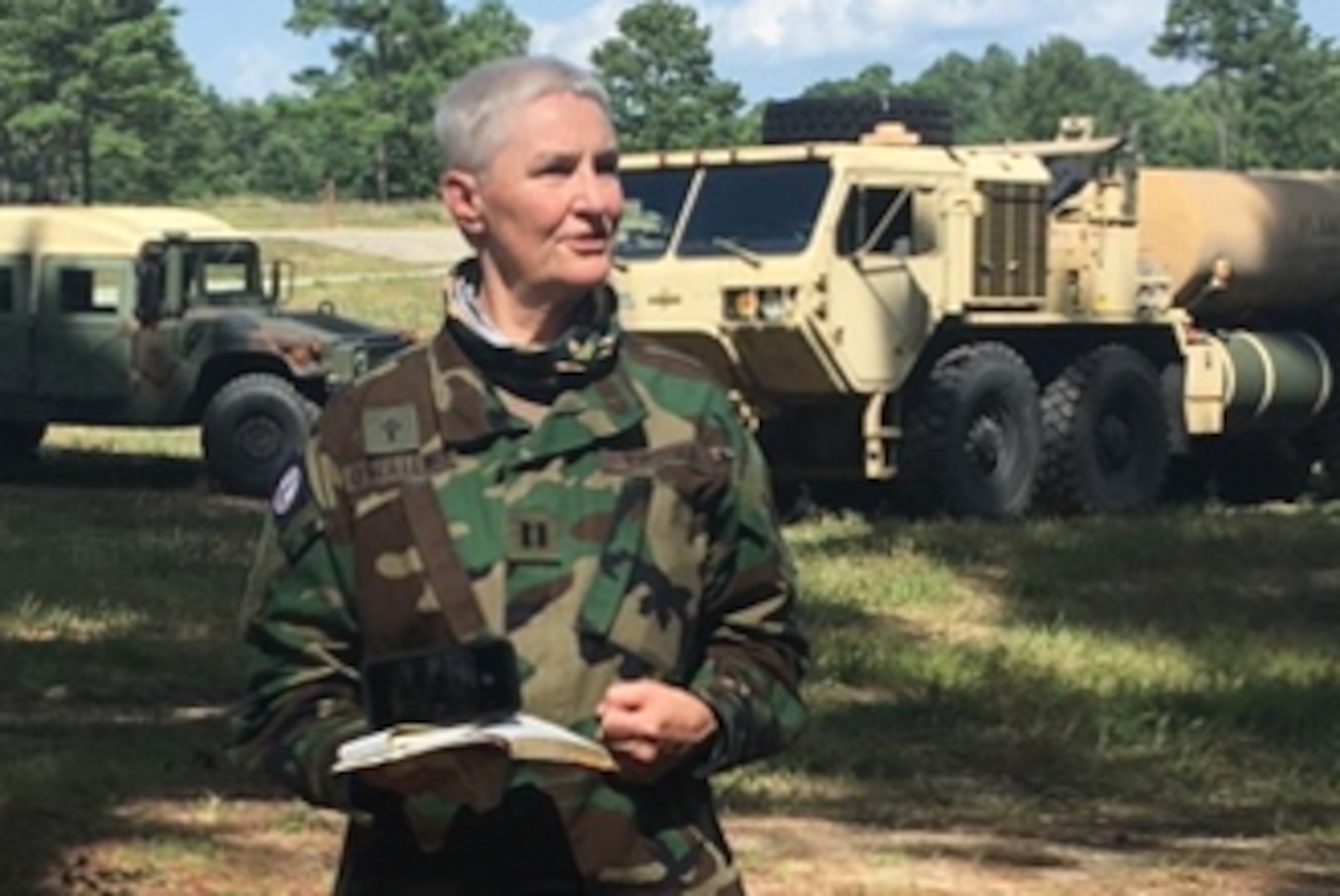 Capt. (Va.) Deb O'Neil-Lewis, a chaplain with the Virginia Defense Force, leads a field service during the Summer 2020 annual training season at Fort Pickett, Virginia.