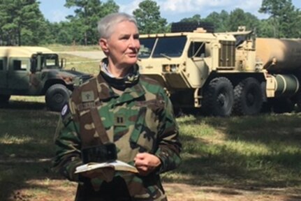 Capt. (Va.) Deb O'Neil-Lewis, a chaplain with the Virginia Defense Force, leads a field service during the Summer 2020 annual training season at Fort Pickett, Virginia.