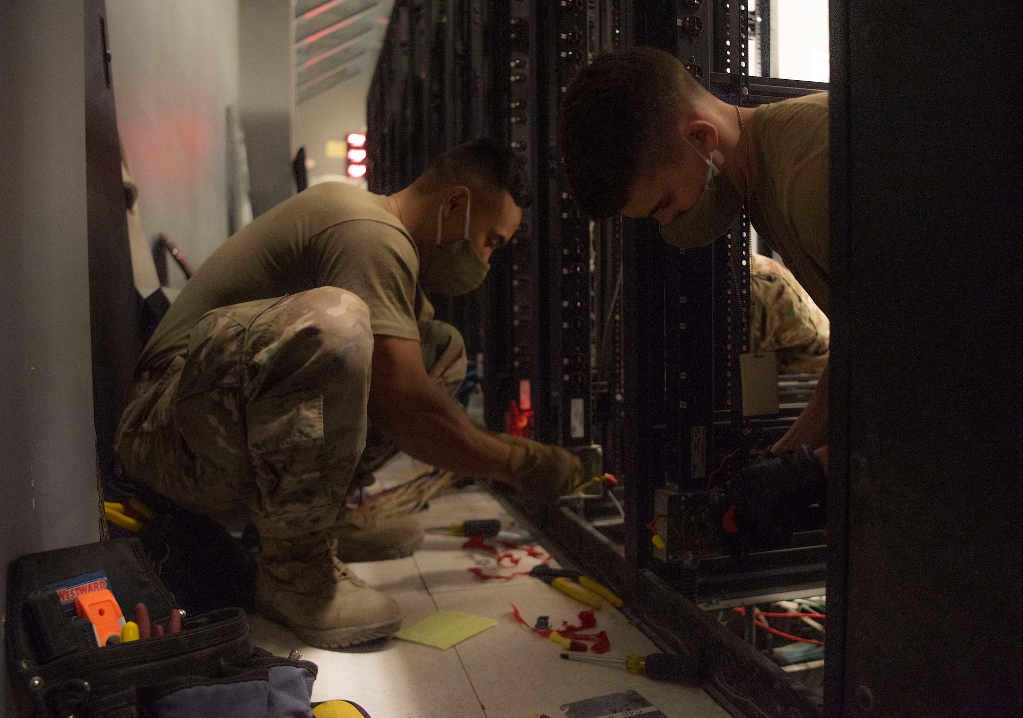 U.S. Air Forces Central Airmen from the Combined Air Operations Center, Al Udeid Air Base, Qatar, set up work stations during facility renovations Nov. 10, 2020.