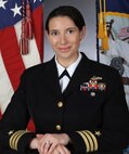 Studio portrait of Cmdr. Alexa F. Jenkins.