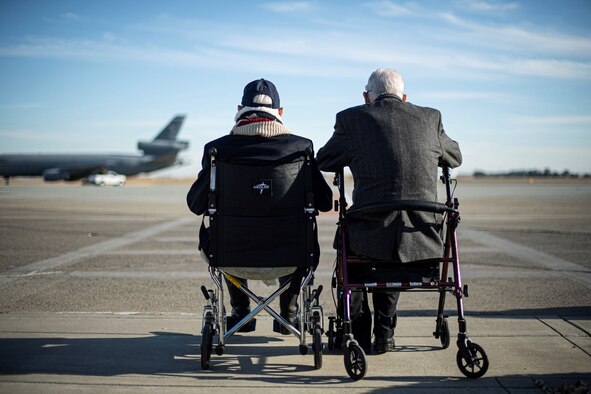 Dean “Diz” Laird, a World War II pilot famous for confirming kills in both the European and Pacific Theater, left, and Clarence “Bud” Anderson, three-time World War II flying ace, watch as a KC-10 Extender is taxied Nov. 10, 2020, at Travis Air Force Base, California. (U.S. Air Force photo by Senior Airman Christian Conrad)