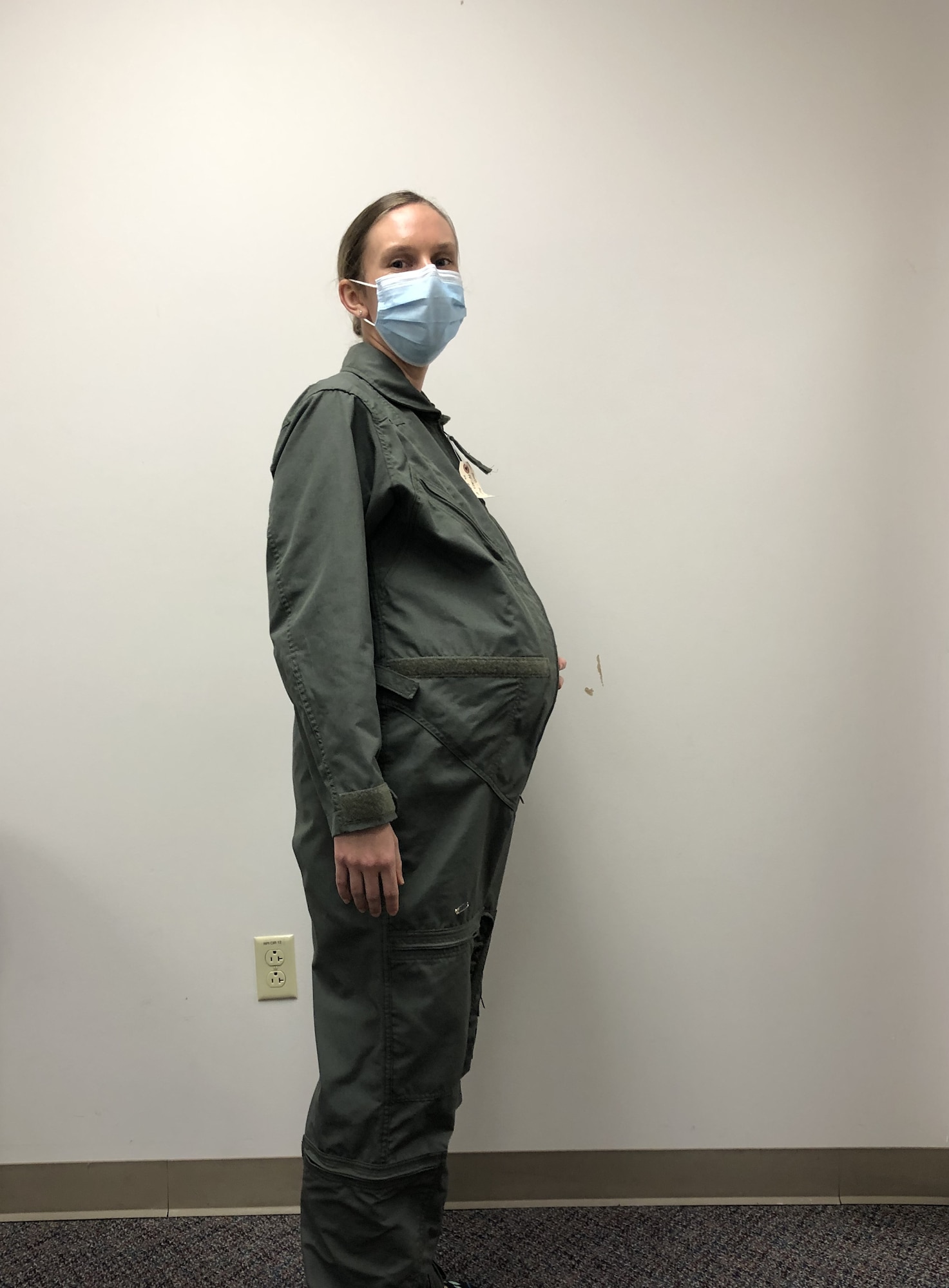 1st Lt. Avery Thomson, lead program manager for Maternity Development efforts in the Air Force Uniform Office, models a Maternity Flight Duty Uniform while wearing an artificial pregnancy bump. (Courtesy photo)