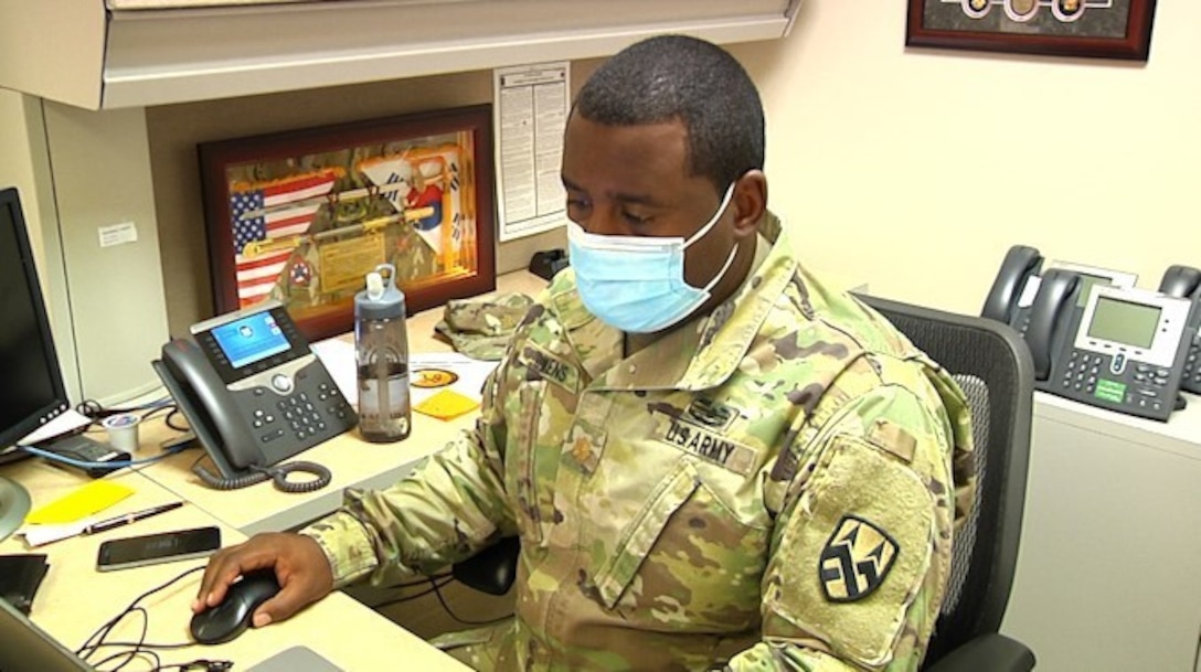 Maj. Mack Owens III, a plans officer in the G-5 section of the 377th Theater Sustainment Command, coordinates with subordinate elements from the command headquarters in Belle Chasse, La., Nov. 13, 2020.