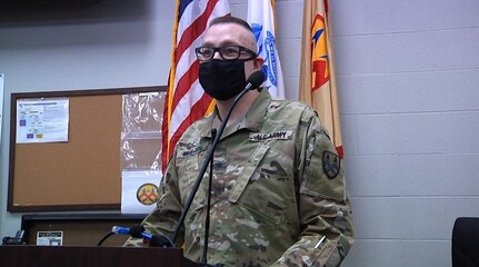 Col. Charles Moulton, senior plans officer at the 377th Theater Sustainment Command, addresses troops during a meeting at the Belle Chasse, La. command headquarters, Nov. 13, 2020.