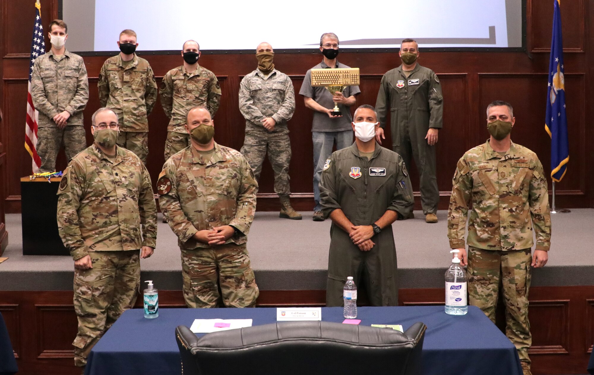 Group photo of the 552 ACNS 'Team Dune' with judges