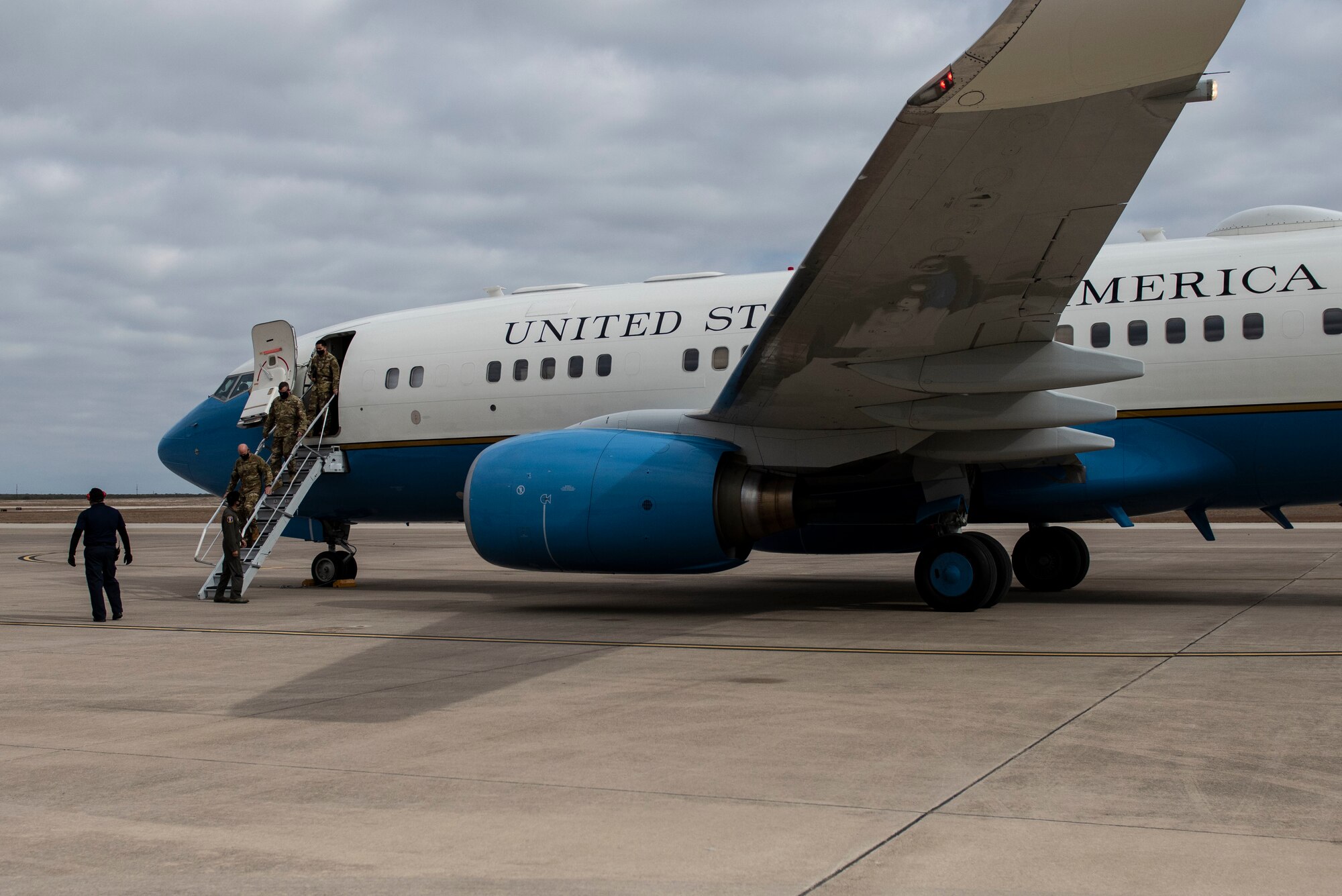 The crew from the 89th Airlift Wing at Joint Base Andrews, Md., departs their C-40B on Nov. 18, 2020 Laughlin Air Force Base, Texas. The C-40B/C provides safe, comfortable and reliable transportation for U.S. leaders to locations around the world. The C-40B's primary customers are the combatant commanders, and the C-40C customers include members of the Cabinet and Congress. The aircraft also performs other operational support missions. (U.S. Air Force photo by Airman 1st Class David Phaff)