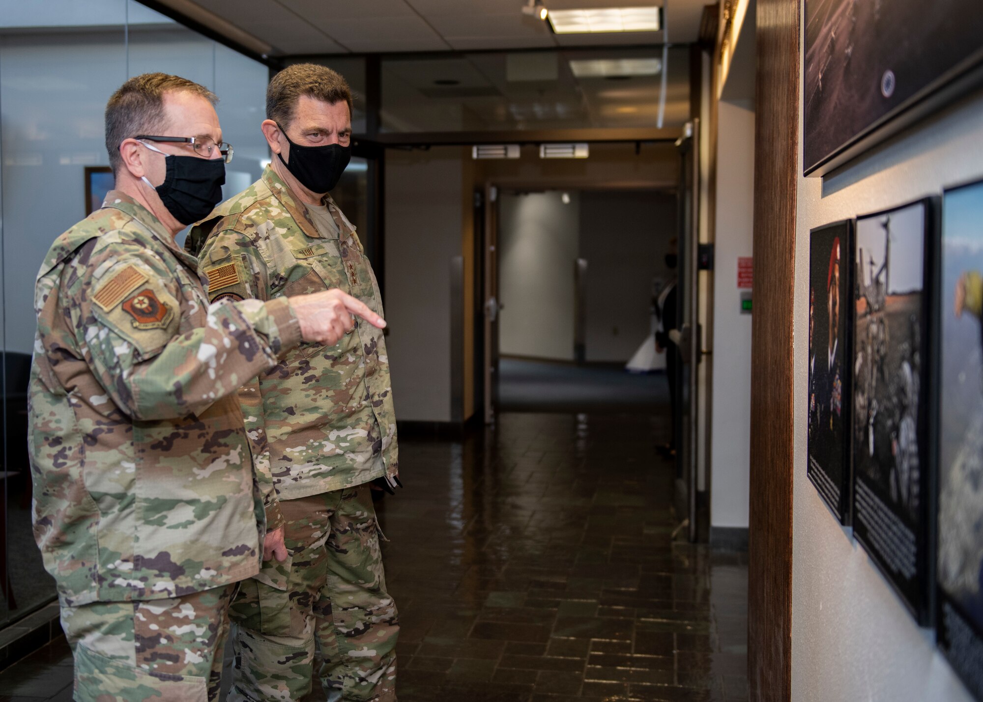 U.S. Air Force Lt. Gen. Jim Slife, left, commander of Air Force Special Operations Command, speaks with U.S. Air Force Lt. Gen. Michael Loh, director of the Air National Guard, during a base visit on Hurlburt Field, Florida, Nov. 18, 2020.