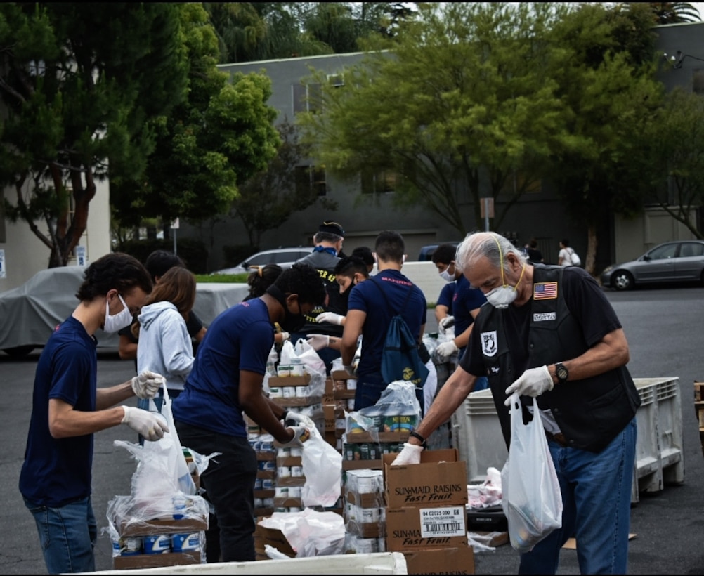 Marine recruiters and future Marines with Recruiting Sub-Station Burbank, Recruiting Station Los Angeles, prepare and sort donated food while volunteering for the Justin and Kourtney Turner Food Bank in Los Angeles, June 20, 2020. With the COVID-19 virus pandemic continuing, Los Angeles County has received more confirmed cases than the surrounding counties. Joined by other volunteer organizations, the RSS Burbank Marines sorted and separated food into more than 200 boxes that could feed up to 800 people. (Photo Courtesy)