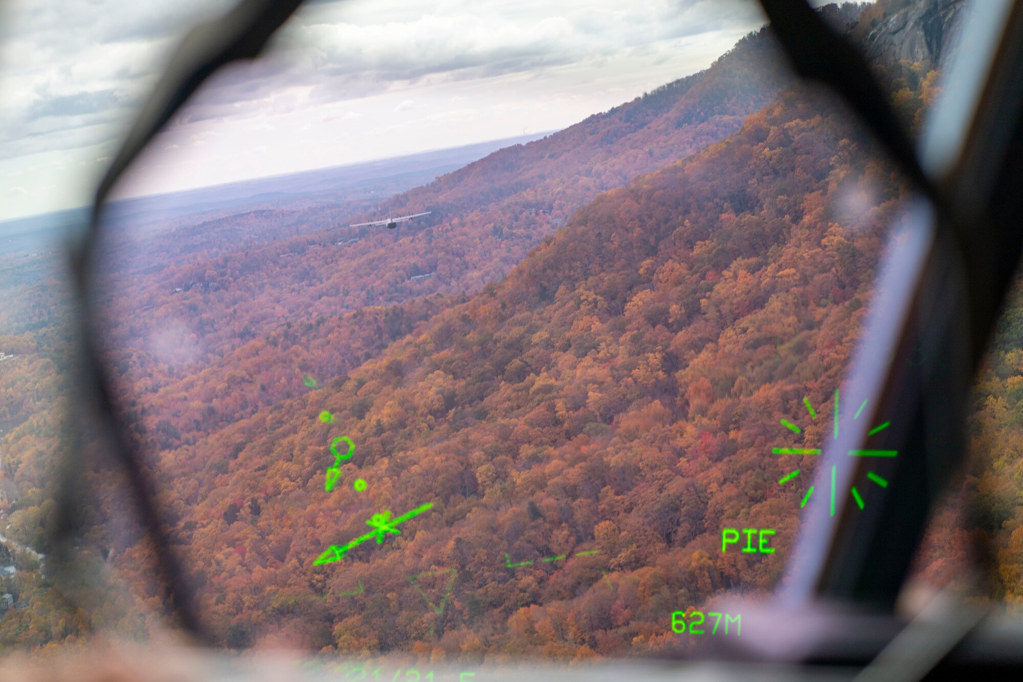 A C-130J Super Hercules flies over the mountains in West Virginia.