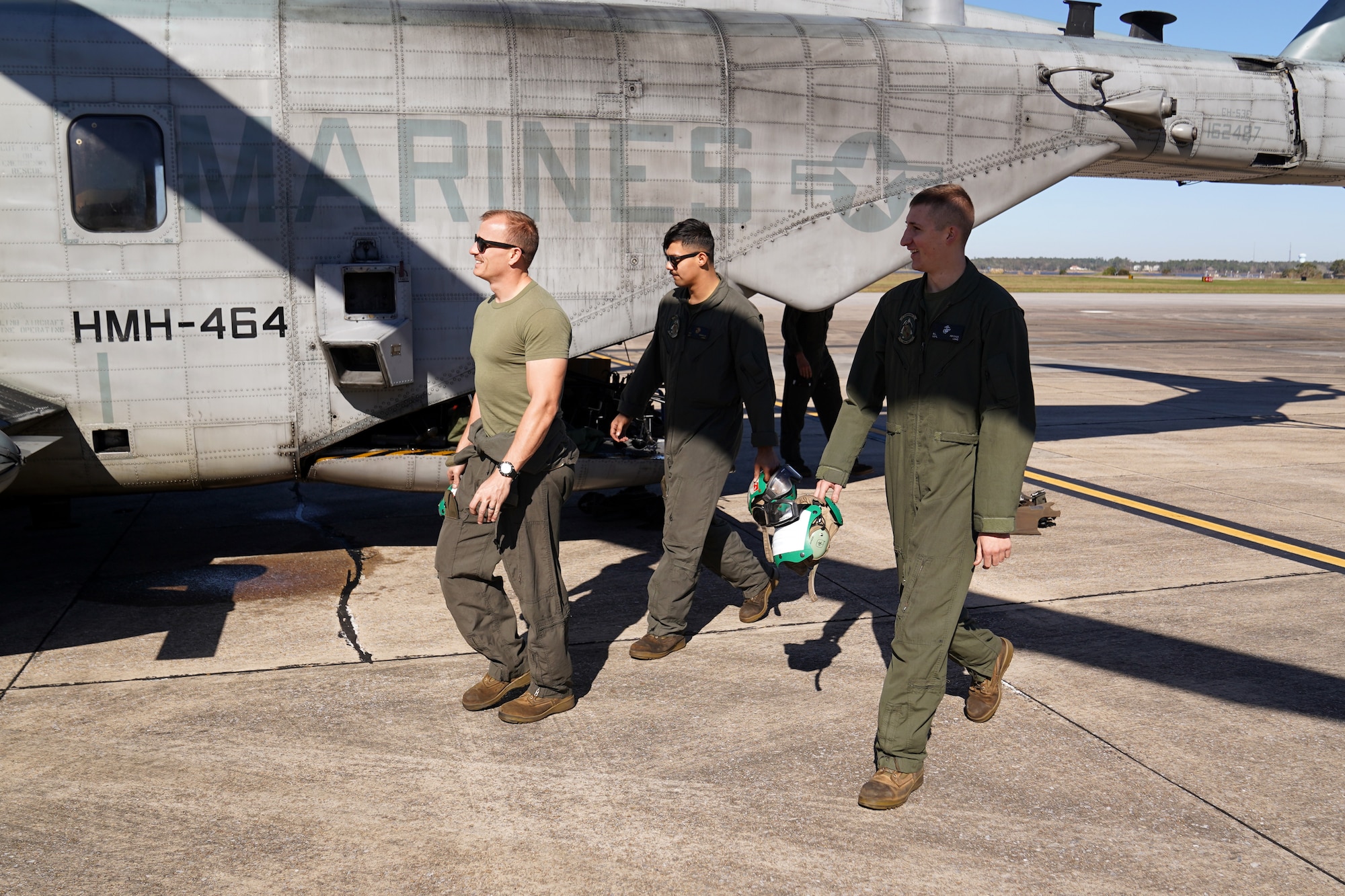 U.S. Marine Corps Marines walk around a Sikorsky CH-53E Super Stallion on the flightline at Keesler Air Force Base, Mississippi, Nov. 17, 2020. Marines came to Keesler to conduct routine training operations in and around the Mississippi area. (U.S. Air Force photo by Airman 1st Class Seth Haddix)