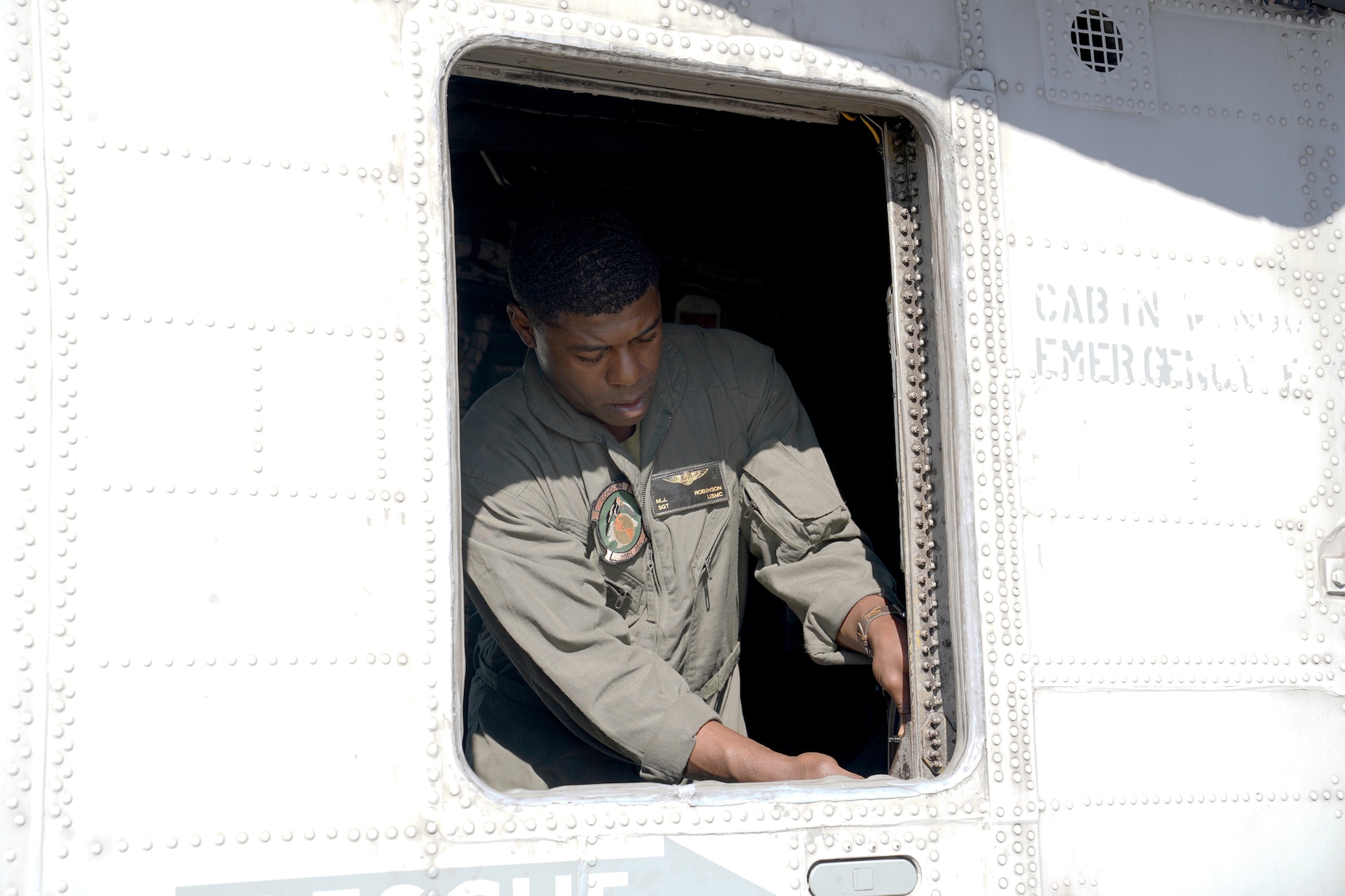 U.S. Marine Corps Sgt. Michael Robinson, Marine Heavy Helicopter Squadron 464 aerial aviations operations specialist, Marine Corps Air Station New River, North Carolina, conducts a pre-flight inspection on a Sikorsky CH-53E Super Stallion on the flightline at Keesler Air Force Base, Mississippi, Nov. 17, 2020. Marines came to Keesler to conduct routine training operations in and around the Mississippi area. (U.S. Air Force photo by Airman 1st Class Seth Haddix)