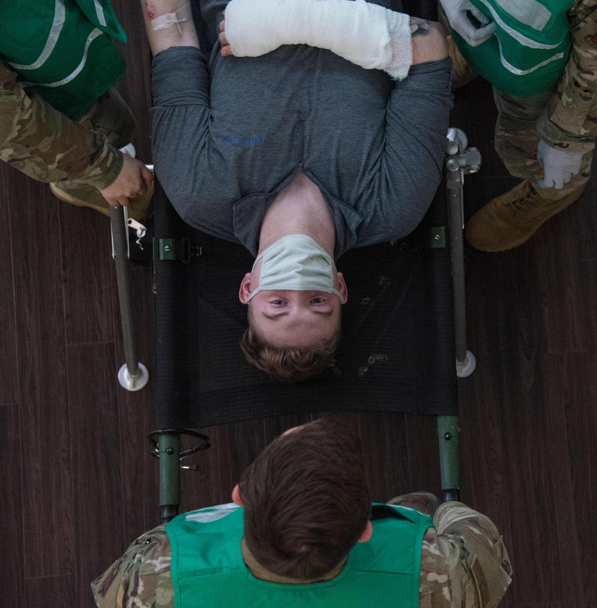A mock patient receives care during a base readiness exercise at Spangdahlem Air Base, Germany, Nov. 17, 2020. This particular exercise inject allowed for medical personnel to train by responding to patients who may have come in contact with possible airborne contamination. (U.S. Air Force photo by Senior Airman Chance D. Nardone)
