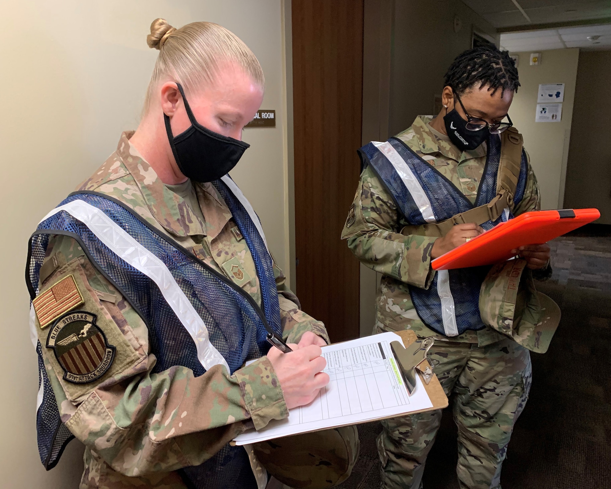 Master Sgt. Crystal Carroll, and Master Sgt. Amanda Taylor, 926th Wing active shooter inspection team members, evaluate the wing’s response to an active shooter exercise Nov. 6, 2020, at Nellis Air Force Base, Nev. (U.S. Air Force photo by Natalie Stanley)