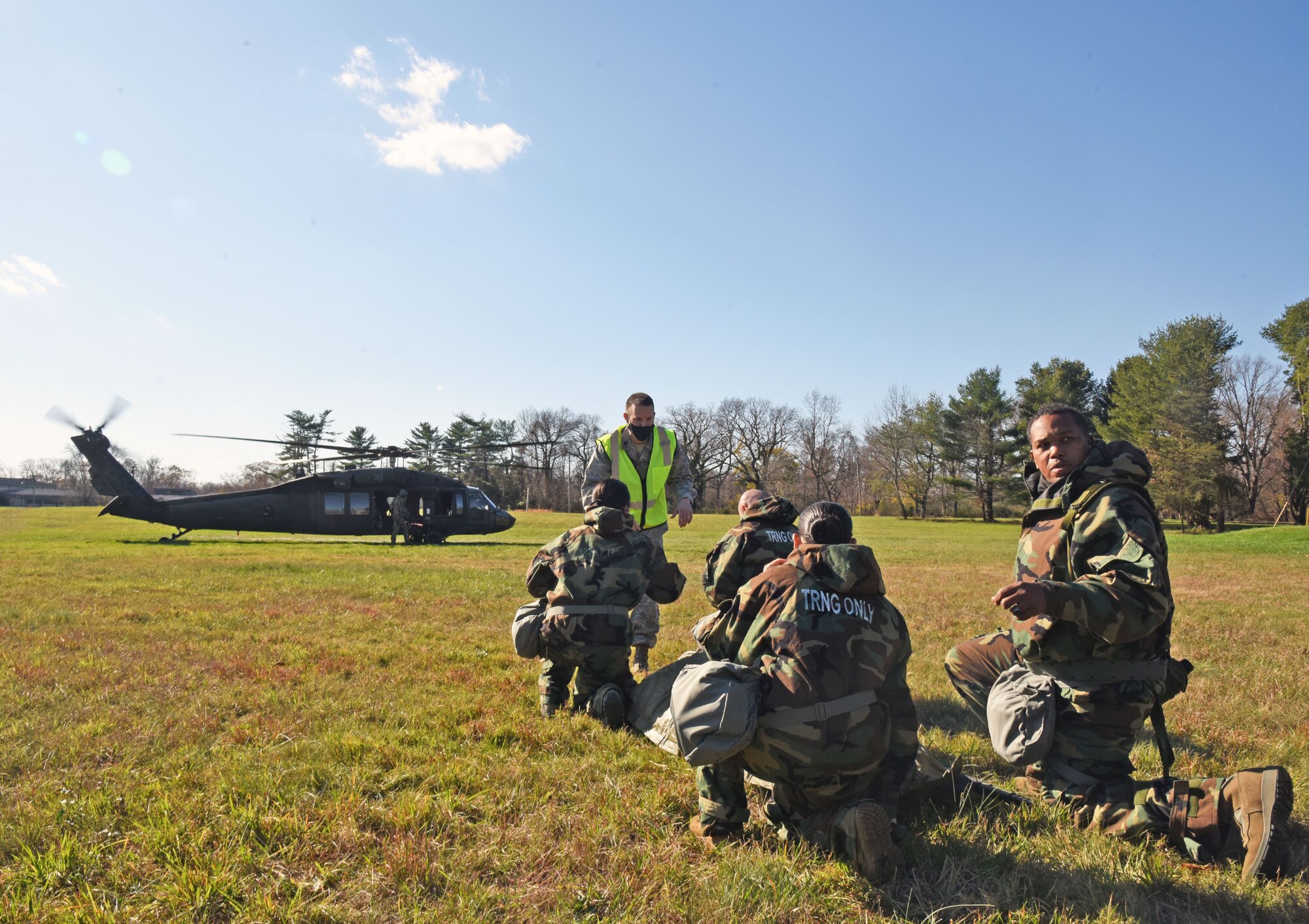U.S. Air Force Lt. Col. Joshua Swantek, 108th Medical Group wing inspection team leader, prepares participants for their first MEDEVAC tactical combat casualty care mock casualty training at the Babe Ruth Field, Nov. 16, 2020 at Joint Base McGuire-Dix-Lakehurst, N.J. This training helps military personnel on how to transport patients in and out of moving vehicles. (U.S. Air Force photo by Daniel Barney)