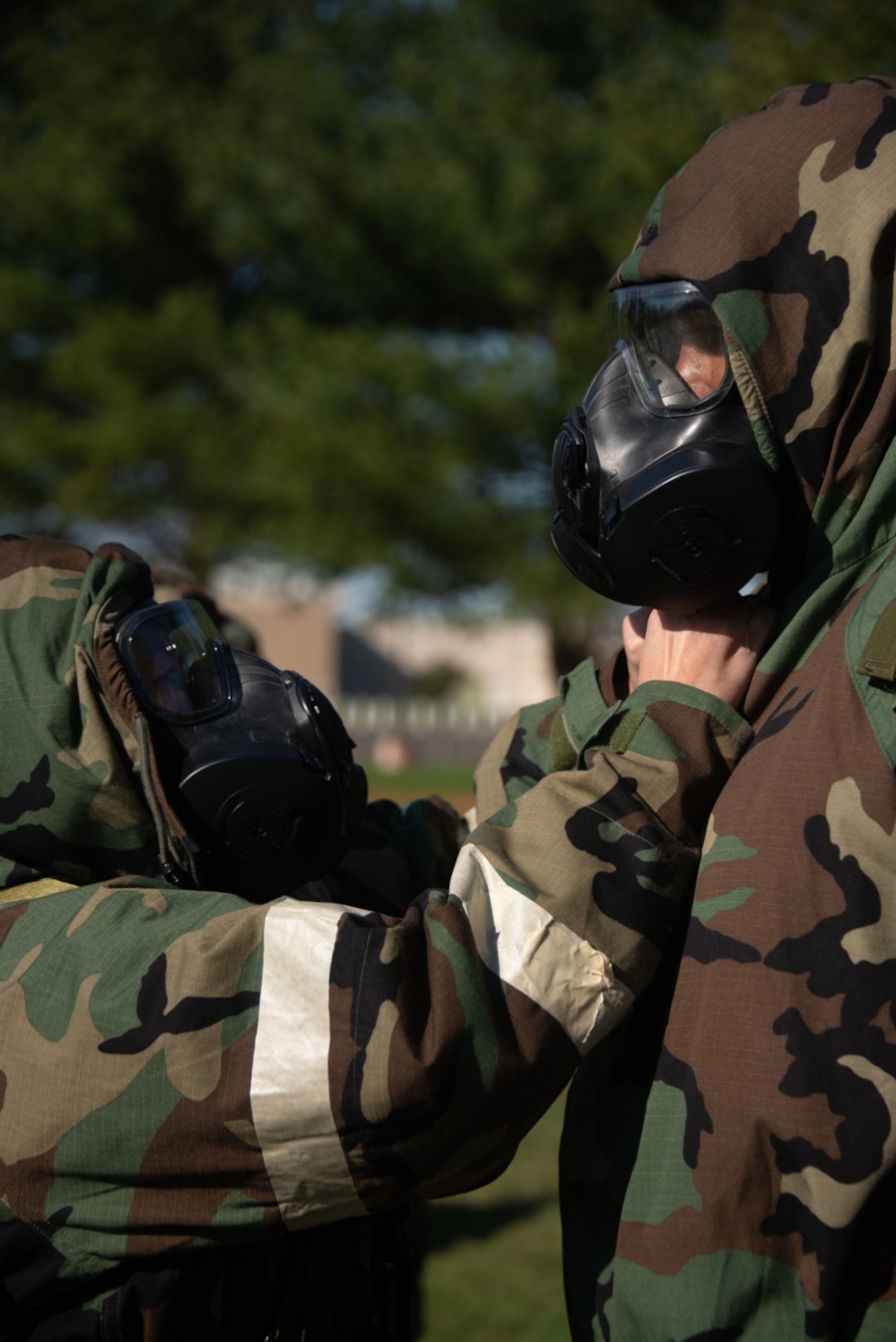 Airmen from the 108th Wing check each others Mission Oriented Protective Posture gear as part of the Medical Evacuation and Tactical Combat Casualty Care training on Joint Base McGuire-Dix-Lakehurst, N.J. Nov. 16, 2020. The MEDEVAC TCCC training gives a basic understanding of how service members can apply emergency triage in any applicable situation in a deployed environment. (U.S. Air Force photo by Airman 1st Class Joseph Morales)