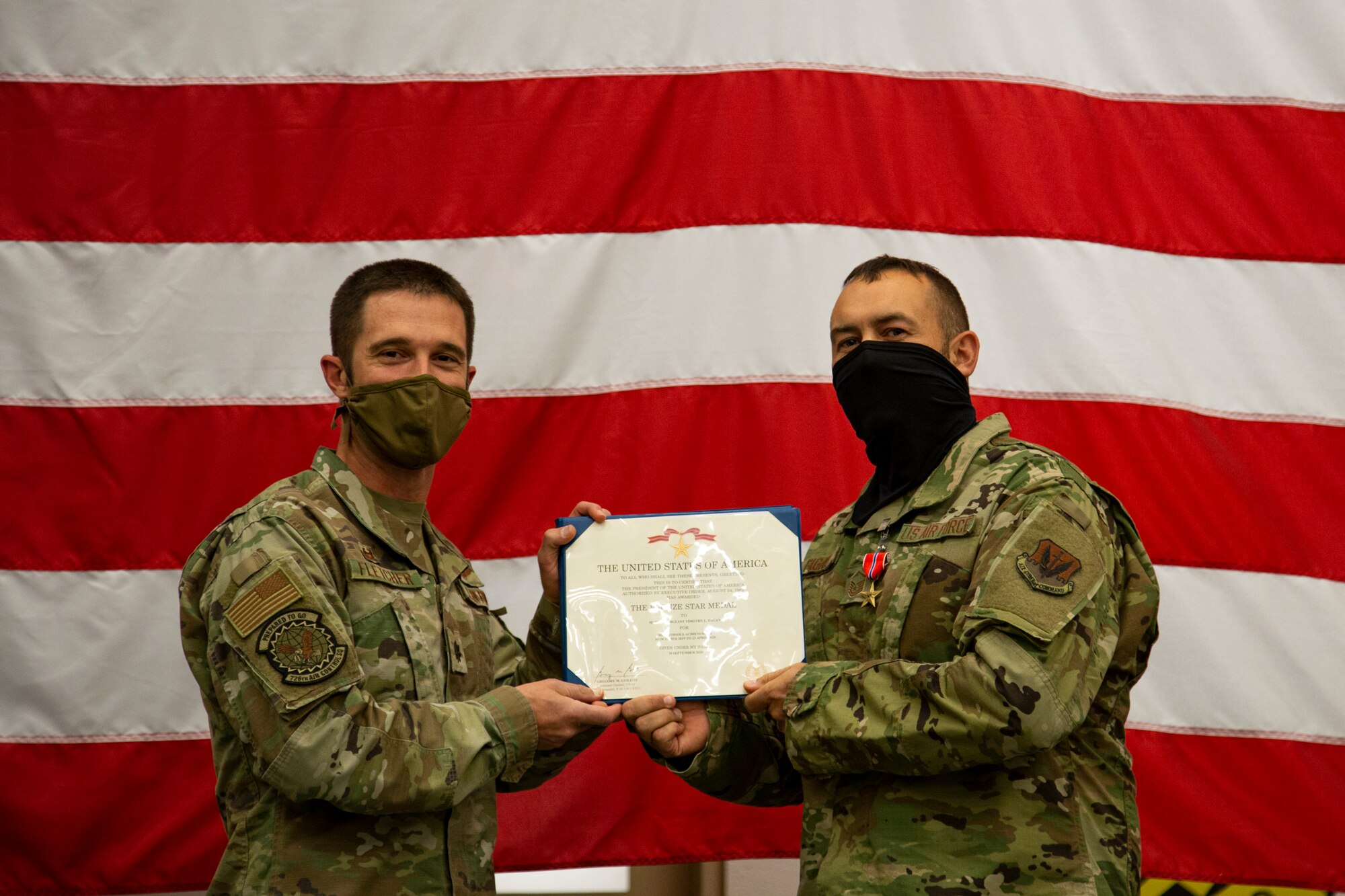 Lt. Col. Kevin Fletcher, 726th Air Control Squadron commander and Master Sergeant Timothy Fagan, 726th Air Control Squadron signal communications operation flight superintendent, poses for a photo, at Mountain Home Air Force Base, Idaho, Oct. 16, 2020. Fagan was deployed to Iraq for nine months, and faced a multitude of challenges while there, including an Iranian theater ballistic missile strike. (U.S. Air Force Photo by Airman 1st Class Eric Brown)