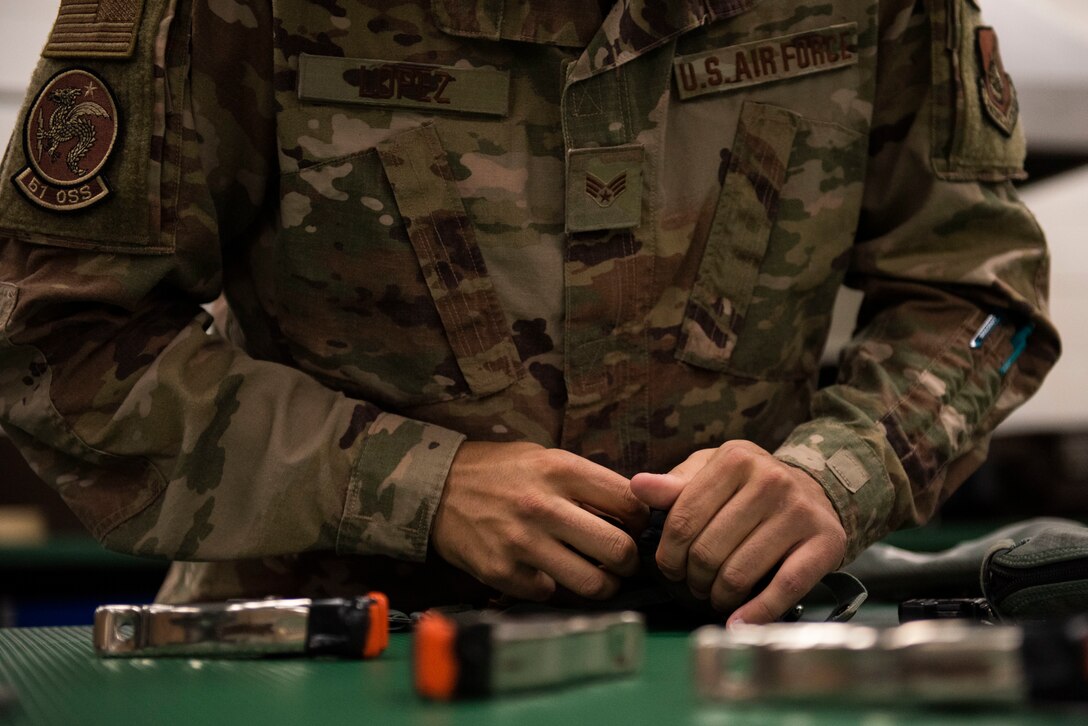 An Airman packs a life preserver unit