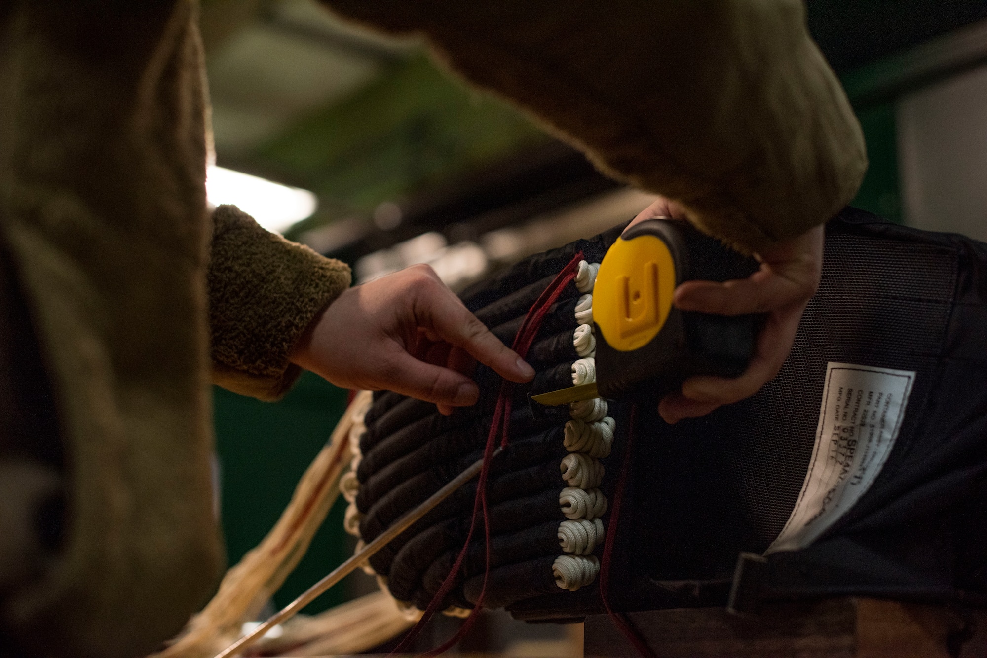 An Airman packs a parachute