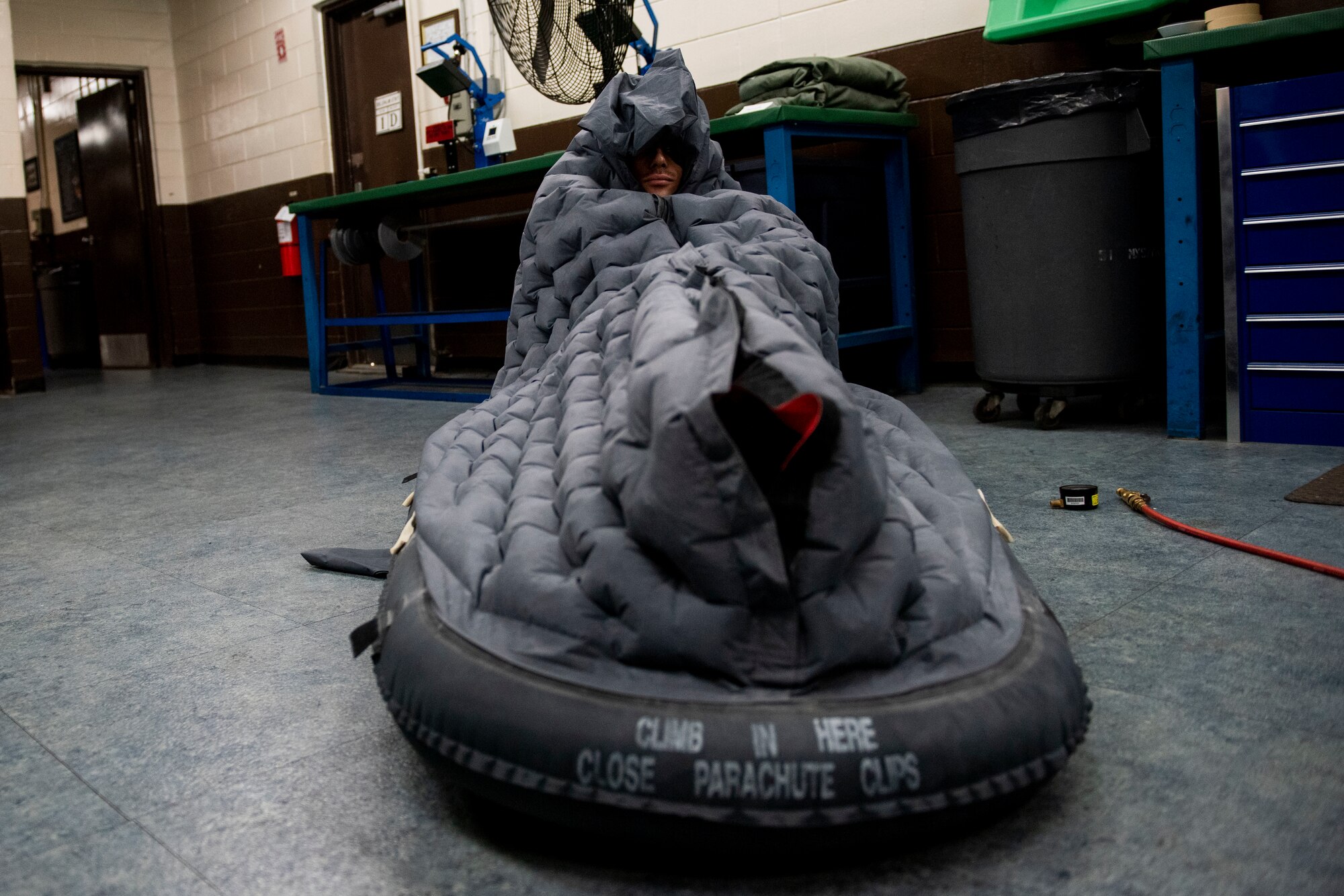 An Airmen demonstrates use of a raft