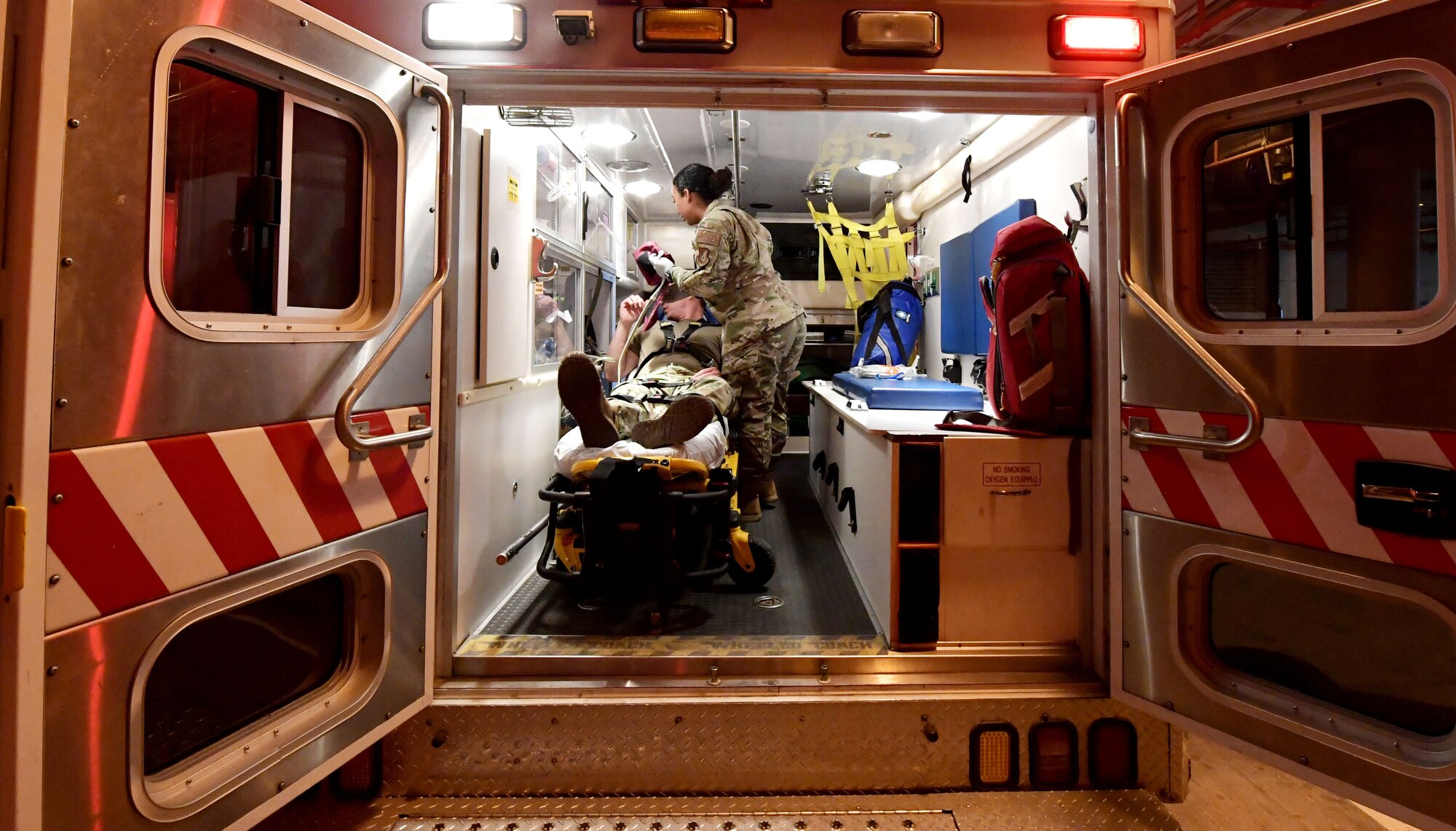 Staff Sgt. Anjelica Scott, 51st Medical Group medical technician, Examines a simulated patient wounds in an ambulance at Osan Air Base, Republic of Korea, Nov. 18, 2020. Scott works in the emergency room here and is one of the first people to respond to incidents on base. (U.S. Air Force photo by Senior Airman Noah Sudolcan)