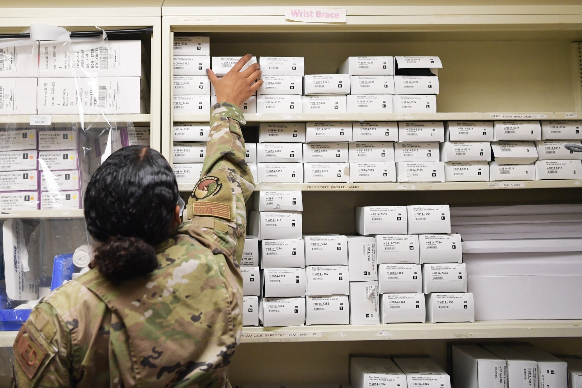 Staff Sgt. Anjelica Scott, 51st Medical Group medical technician, retrieves supplies at Osan Air Base, Republic of Korea, Nov. 18, 2020. Emergency department medics provide swift and comprehensive care to patients in critical condition. (U.S. Air Force photo by Senior Airman Noah Sudolcan)