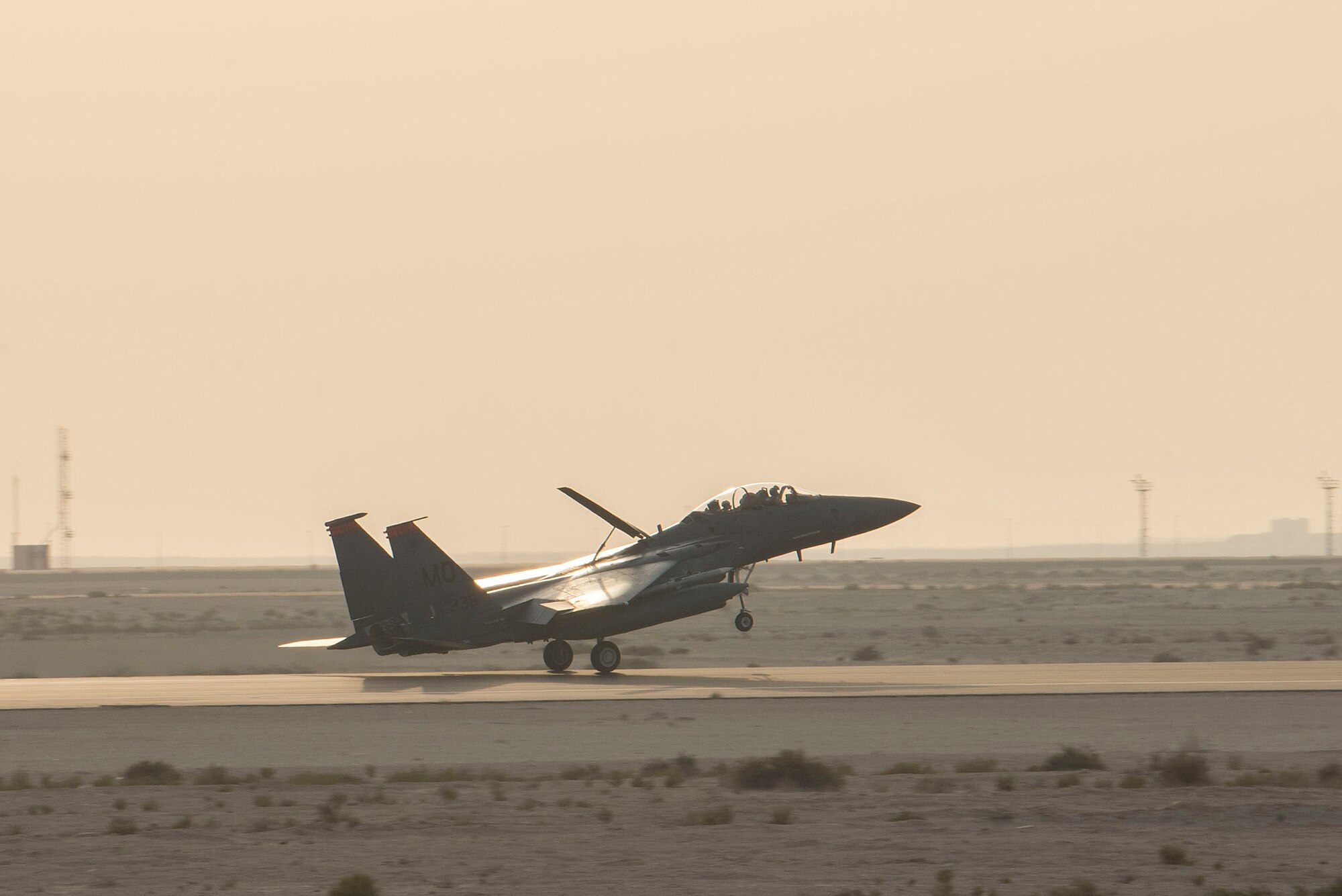 A U.S. Air Force F-15E Strike Eagle assigned to the 332nd Air Expeditionary Wing lands on the flightline at Al Dhafra Air Base, United Arab Emirates, Nov. 17, 2020.