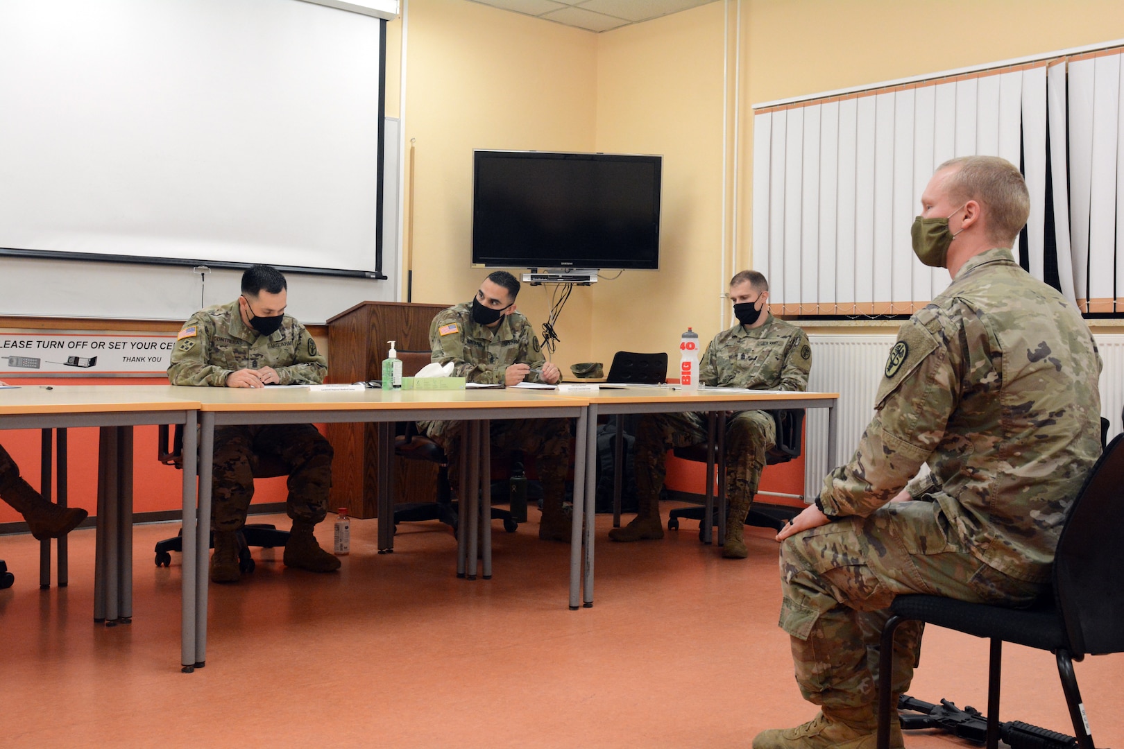 1st Lt. Jacob Schwanz (right), assigned to U.S. Army Medical Department Activity-Bavaria, competes in the oral board portion of the Regional Health Command Europe Best Warrior competition Nov. 3 and 4 in Baumholder.  Schwanz was the winner in the 'Officer' category.
