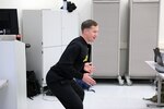 Capt. Daniel Huffman, a physical therapist at Landstuhl Regional Medical Center, demonstrates proper squat technique during a physical readiness training leadership course.