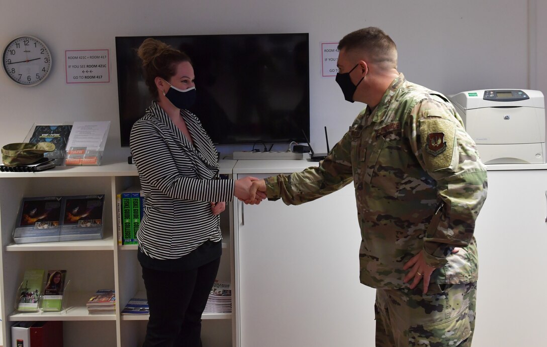 Korinna Inman is coined by U.S. Air Force Chief Master Sgt. Corey Miller, 86th Mission Support Group superintendent, for winning Airlifter of the Week.