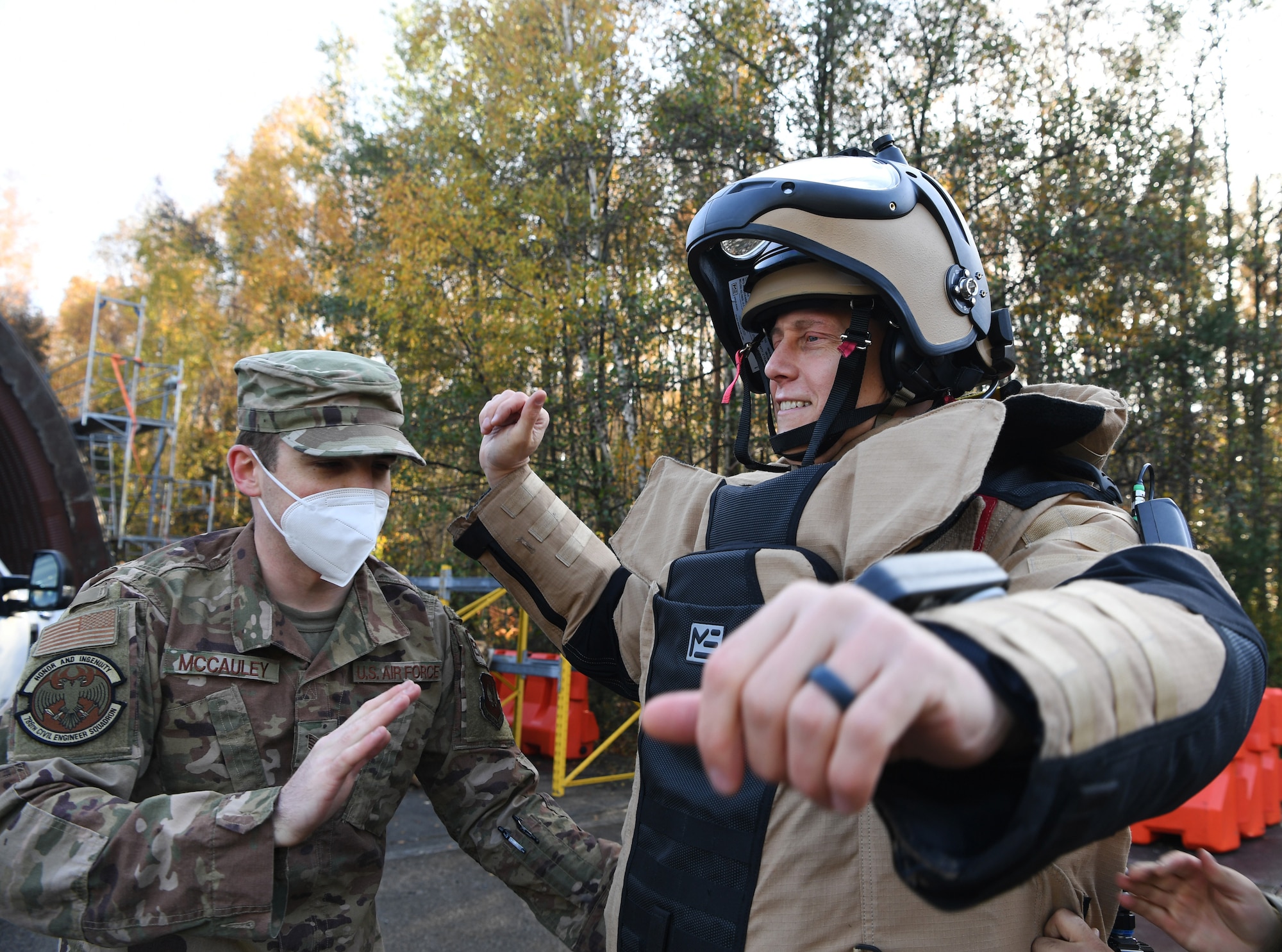 man wears bomb suit