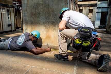 Temporary Services (Code 990) measuring things out for the dry dock build.