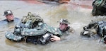 New York Air National Guard Senior Airman Caleb Lapinel trains on tactical swimming in a Brazilian river in October 2020 while attending the  international course conducted annually by the Brazil Jungle Warfare Center, known as CIGS for its Portugese initials. Lapinel was the only American in the class of 10.