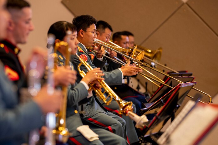 U.S. Marines with the III Marine Expeditionary Force Band and members with the Japan Ground Self-Defense Force 15th Brigade Band perform together during the 25th Annual Combined Concert at Camp Foster, Okinawa, Japan, Nov. 17.