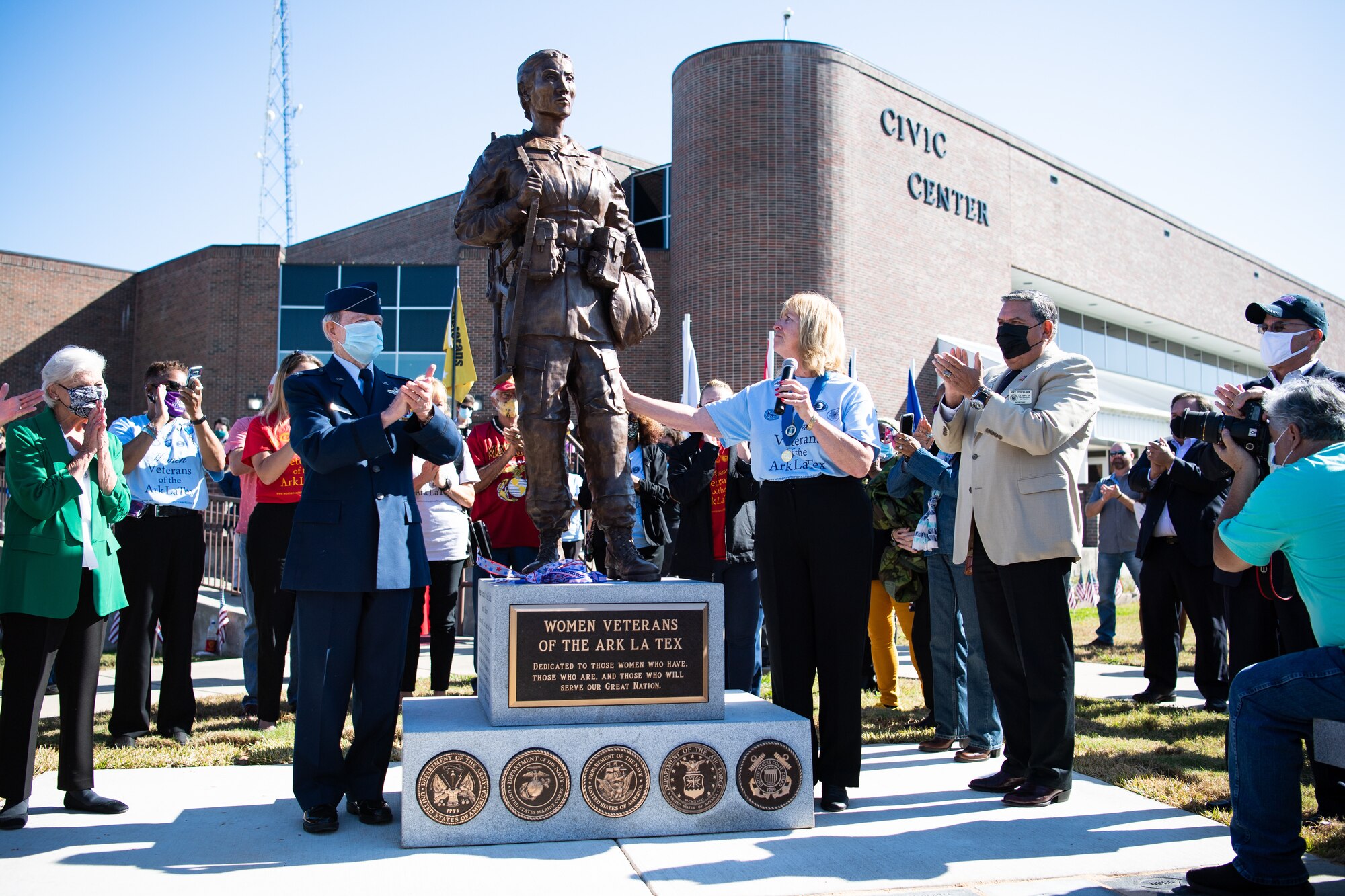Lorenz Walker, Bossier City mayor and retired U.S. Air Force colonel; Sandy Franks, Women Veterans of the Ark-La-Tex president; and Joey Strickland, Louisiana Department of Veterans Affairs secretary, unveil the Women Veterans of the Ark-La-Tex statue at the Bossier City Civic Center in Bossier City, La., Nov. 11, 2020. The Women Veterans of the Ark-La-Tex statue is dedicated to the women, past and present, who have served in the U.S. military. (U.S. Air Force photo by Airman 1st Class Jacob B. Wrightsman)