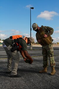 Gerald Evans (left), U.S. Army North Civil Support Training Activity observer controller contractor, and Sgt. 1st Class John Warner (right), an Army Interagency Training Education Center observer controller,  evaluate the work completed by Soldiers from the 181st Chemical, Biological, Radiological and Nuclear Company, during a mass casualty decontamination lane at the Nelson W. Wolff Municipal Stadium Nov. 5. The CSTA plays an important role in training state and regional forces in a range of technical tasks that ensure military forces are ready at any time to respond to a CBRN incident.