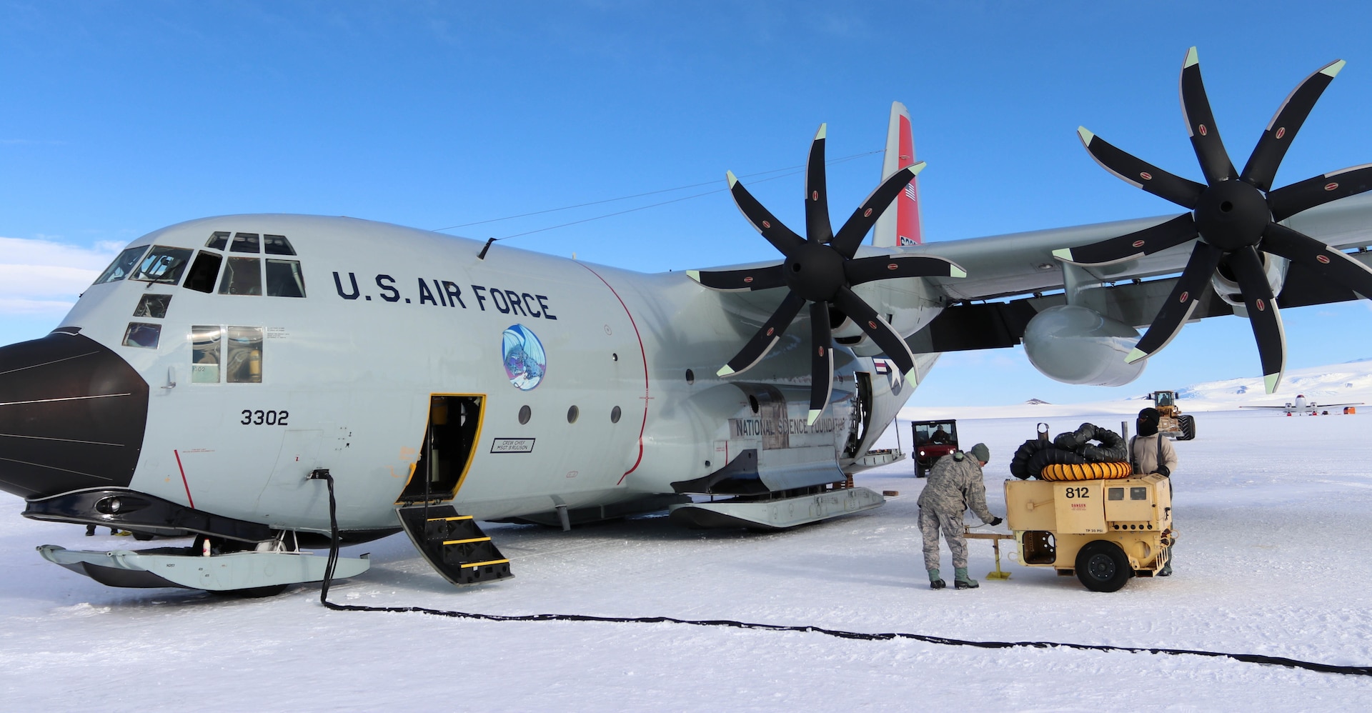 A member of the New York Air National Guard's 109th Airlift Wing performs maintenance on an LC-130, ski-equipped aircraft at McMurdo Station, Antarctica, on Dec. 17, 2018. The 109th normally provides logistics support to U.S. Antarctic research operations by flying people, equipment and supplies around the continent. Because of COVID-19, the wing will deploy aircraft to New Zealand this year where they will be on standby.