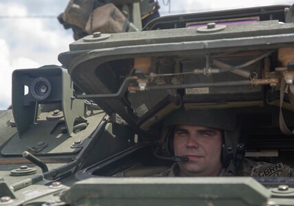 Spc. Ronnie Mathis, a Nuclear, Biological, Chemical Reconnaissance Vehicle (NBCRV) specialist with 690th Chemical, Biological, Radiological, and Nuclear (CBRN) Company, drives an NBCRV after a demonstration for the Romanian CBRN delegation on May 29, 2020.