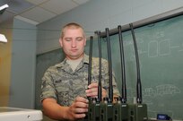 U.S. Air Force Tech. Sgt. Allen Isler, power production specialist, 280th Combat Communication Squadron, Alabama Air National Guard, installs antennas to land mobile radios, during the Hope of Martin Innovative Readiness Training (IRT) at Martin Middle School in Martin, Tenn., July 15.