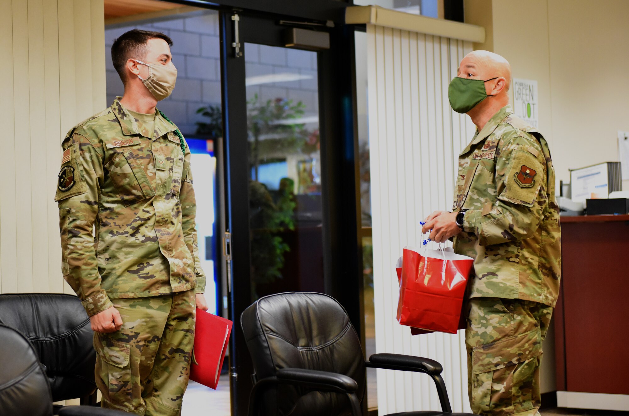 U.S. Air Force Col. Andres Nazario, 17th Training Wing commander, talks with a Goodfellow student before giving out a bag of goodies in the Norma Brown Building on Goodfellow Air Force Base, Texas, Nov. 17, 2020. A local business donated bags with thank notes for military members. (U.S. Air Force photo by Airman 1st Class Dominique Parham)