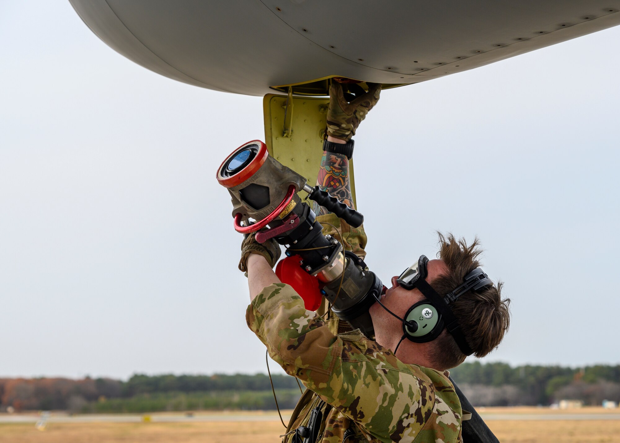 A U.S. Airman with the 1st Special Operations Squadron from Kadena Air Base, Japan, unhooks the fuel hose during a forward area refueling point (FARP) training at Misawa Air Base, Japan, Nov. 18, 2020. FARP plays a role in the U.S. military’s adaptive basing abilities to deliver airpower and lethality more efficiently anywhere in the world by being able to provide a mobile refueling point anywhere an aircraft can land. (U.S. Air Force photo by Airman 1st Class China M. Shock)
