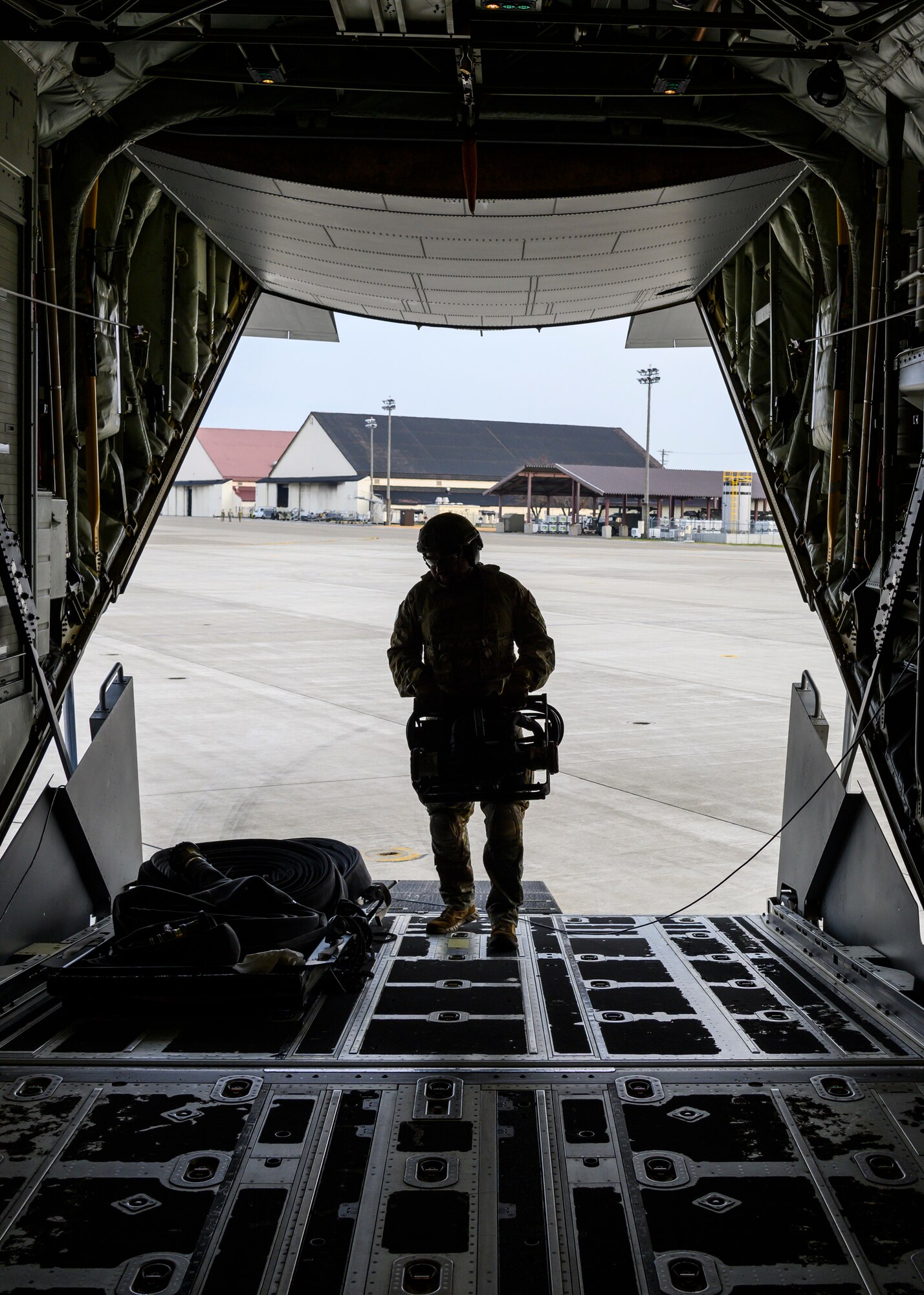 A U.S. Airman with the 1st Special Operations Squadron from Kadena Air Base, Japan, puts equipment away during a forward area refueling point training at Misawa Air Base, Japan, Nov. 18, 2020. This concept allows fighter aircraft to land, replenish fuel or rearm before returning to air-battle operations within a short period of time in harsh territories. (U.S. Air Force photo by Airman 1st Class China M. Shock)