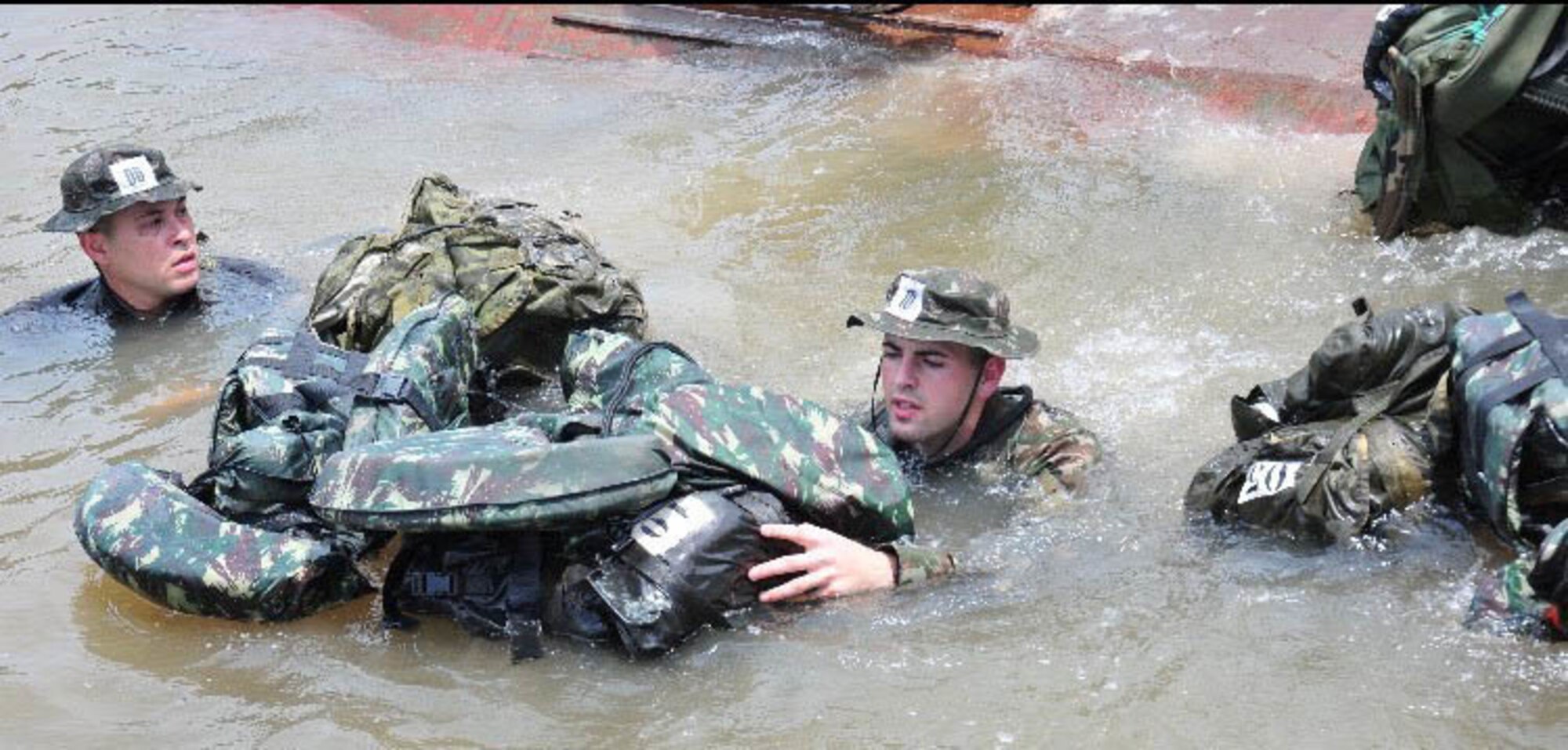 New York Air National Guard Senior Airman Caleb Lapinel trains on tactical swimming in a Brazilian river in October 2020 while attending the  international course conducted annually by the Brazil Jungle Warfare Center, known as CIGS for its Portugese initials. Lapinel was the only American in the class of 10.