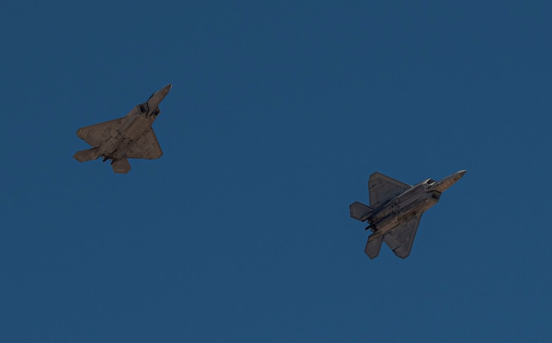 Two F-22s in flight