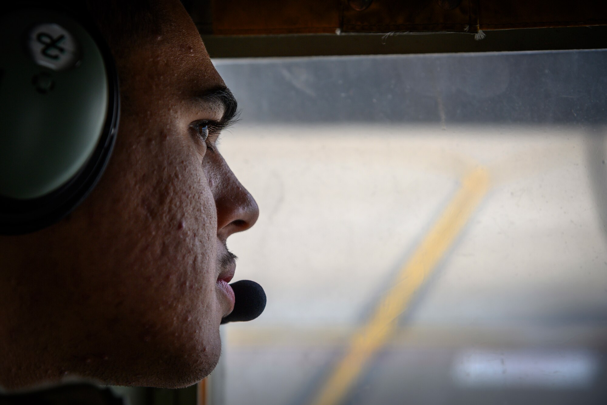 A U.S. Airman with the 1st Special Operations Squadron from Kadena Air Base, Japan, observes forward area refueling point (FARP) training from inside a U.S. Air Force MC-130J at Misawa Air Base, Japan, Nov. 18, 2020. When a fighter squadron has FARP support, options are vastly increased, as any accessible airfield or island can be used to replenish fighters and send them back to the fight. (U.S. Air Force photo by Airman 1st Class China M. Shock)