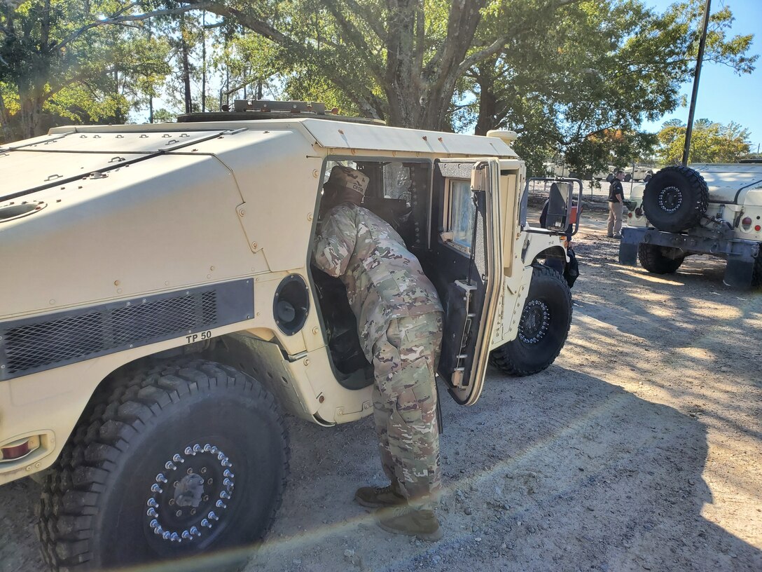 A soldier with the 95th Civil Affairs Brigade inspects a vehicle for anything left inside before it is turned in Nov. 4 at DLA Disposition Services’ Fort Bragg site.