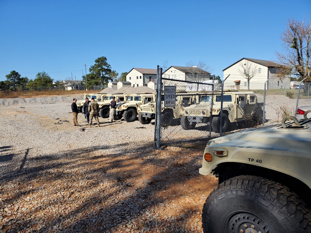 DLA Disposition Services personnel welcome members of the 95th Civil Affairs Brigade arriving Nov. 4 at the Fort Bragg site to turn-in excess Humvees.