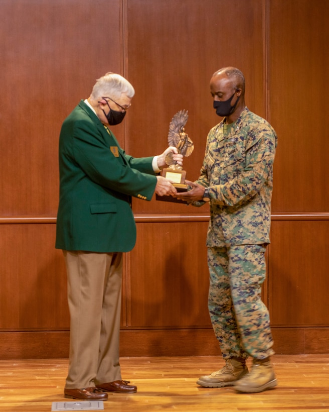 Col. Gerald Graham, the 4th Marine Aircraft Wing chief of staff, accepts the Admiral James S. Russell Naval Aviation Flight Safety Award from Lt. Gen. Nicholas Kehoe, USAF (ret.), the national commander of the Order of the Daedalians, during an award ceremony on Nov. 13, 2020 at Marine Corps Support Facility New Orleans. Pilots with 4th MAW flew more than 20,000 hours with no Class A flight-related or aviation-ground mishaps, which placed it at the top of other competitive commands. (U.S. Marine Corps photo by Lance Cpl. Mitchell Collyer)